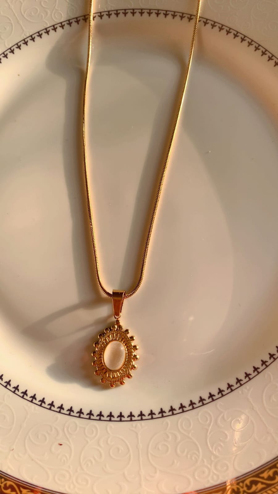 Golden Sunburst Oval Pendant Necklace